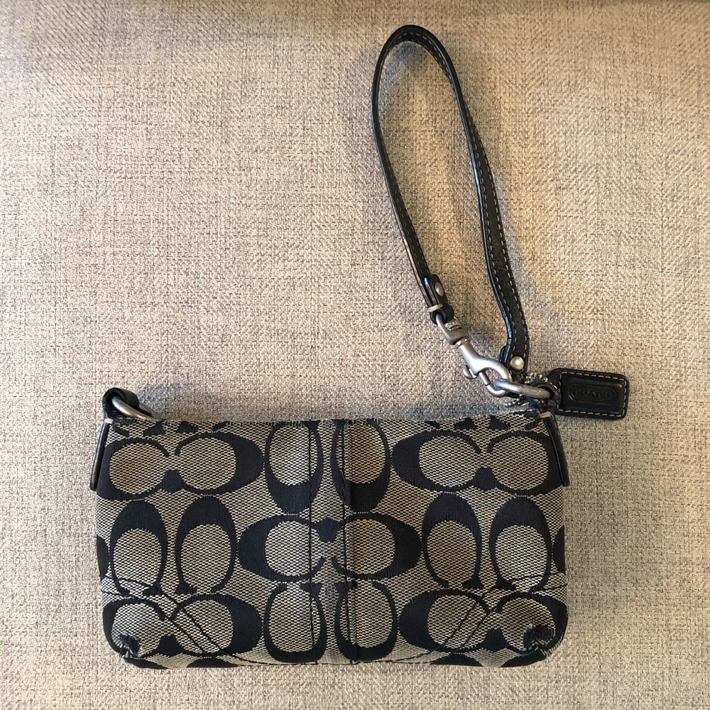 Black and gray Coach wristlet